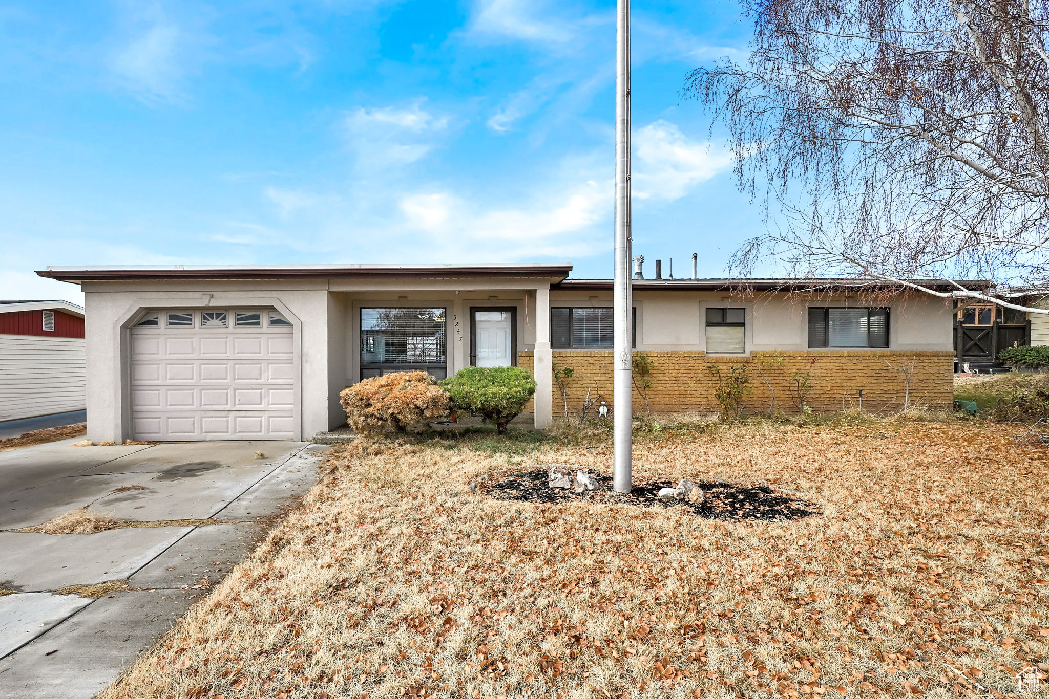 Ranch-style home with a garage