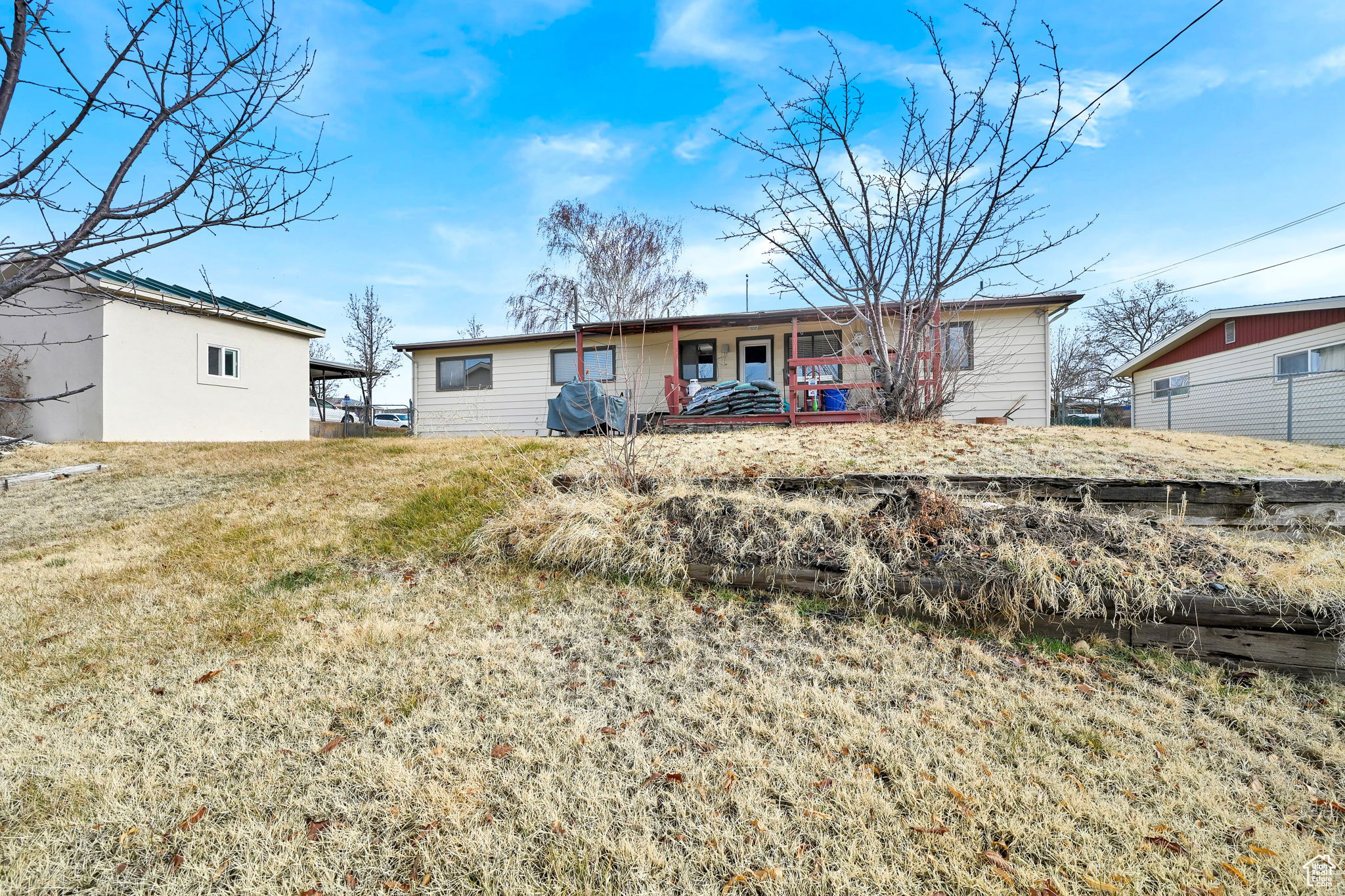 Single story home featuring a front lawn