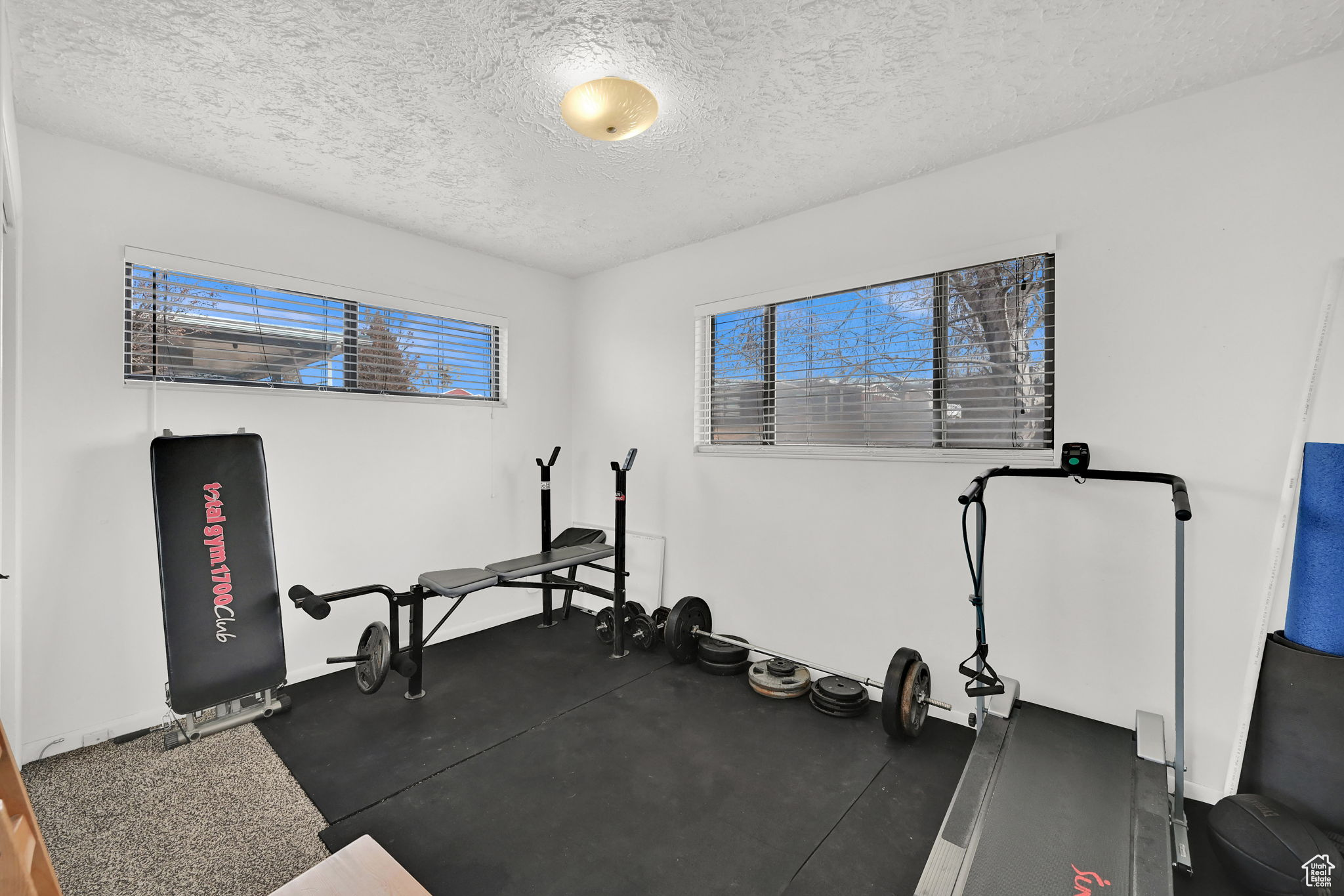 Workout area with a textured ceiling