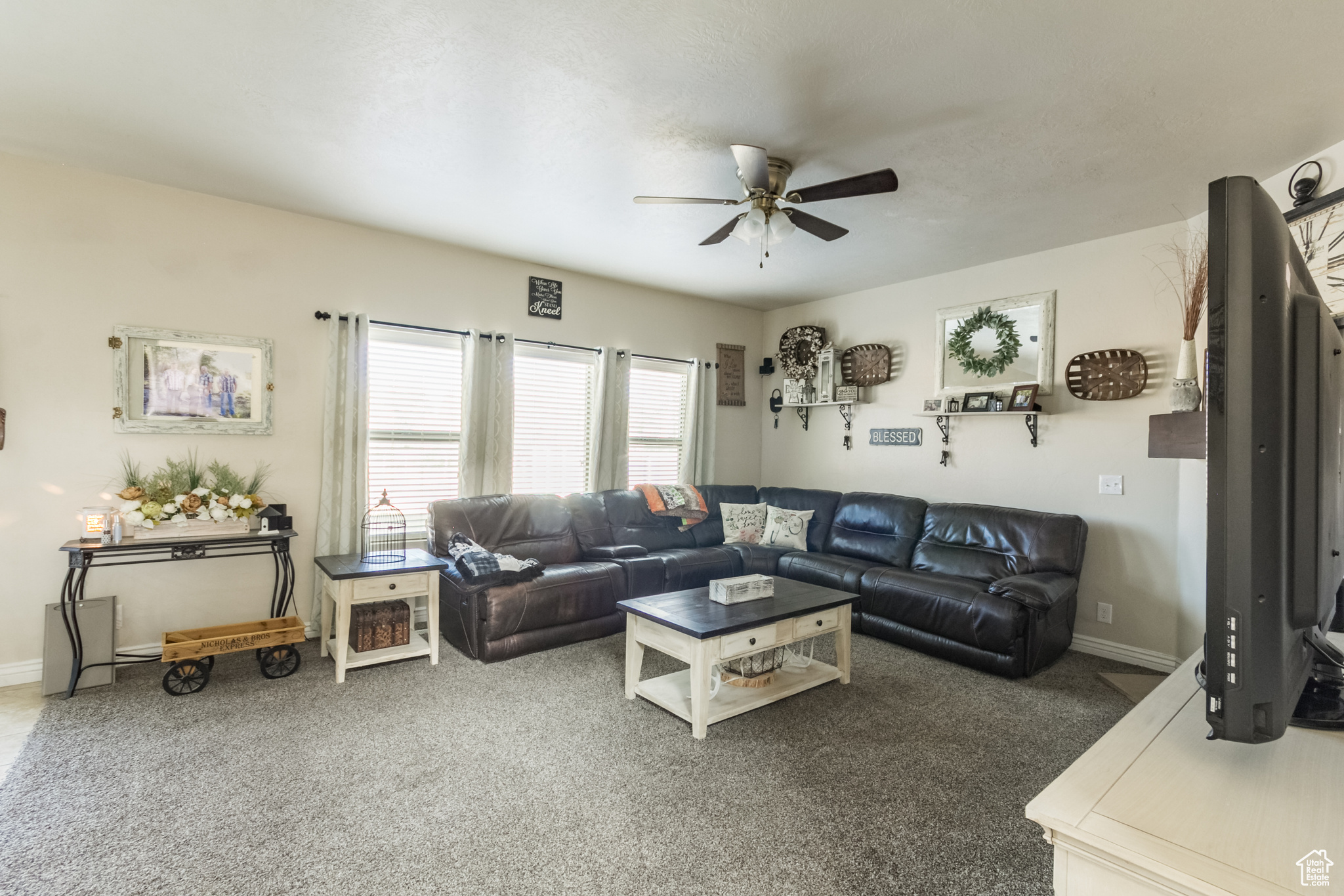 Carpeted family room featuring gas fireplace