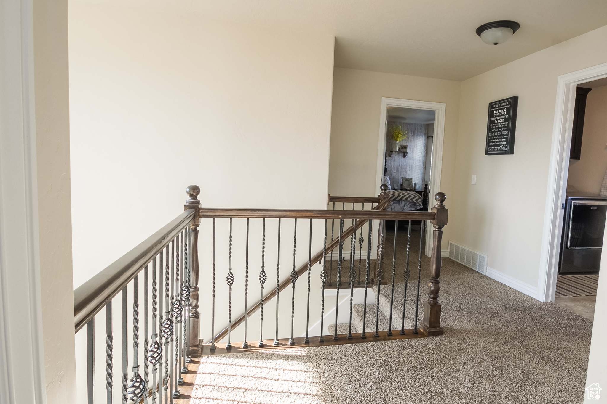 Hallway with carpet flooring