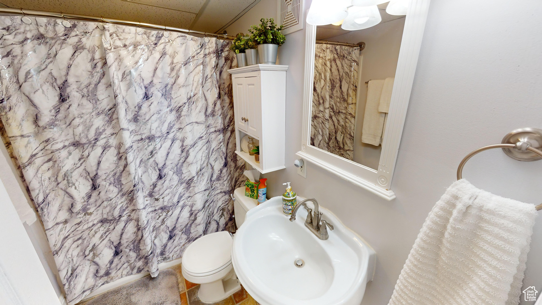 Bathroom with sink and toilet