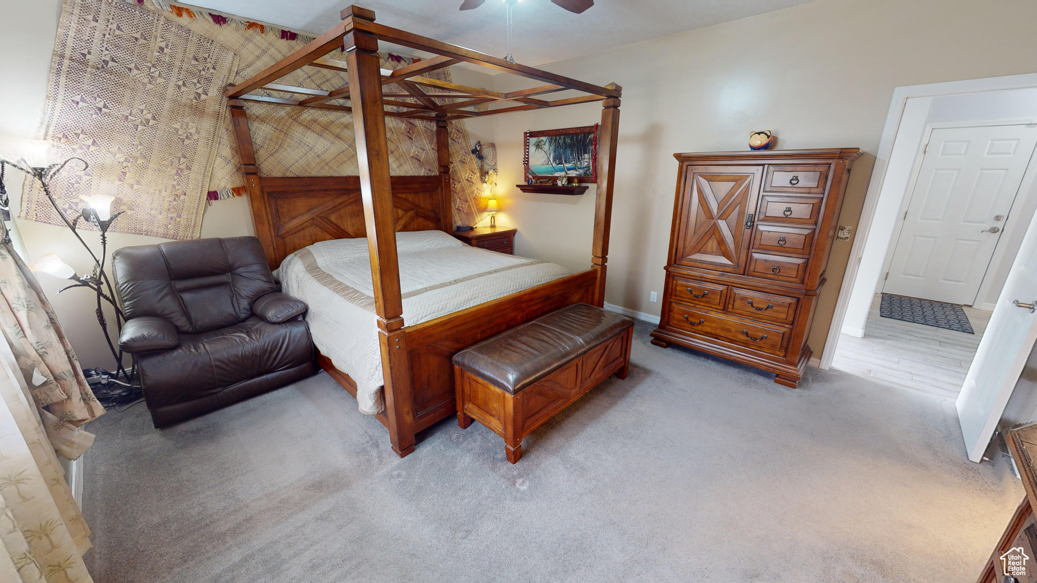 Bedroom featuring ceiling fan and light colored carpet