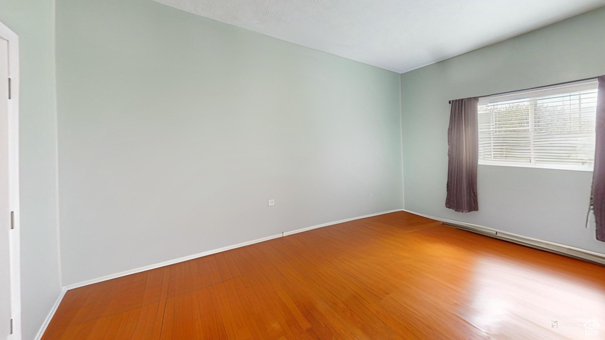 Virtually Un-staged room featuring hardwood / wood-style flooring