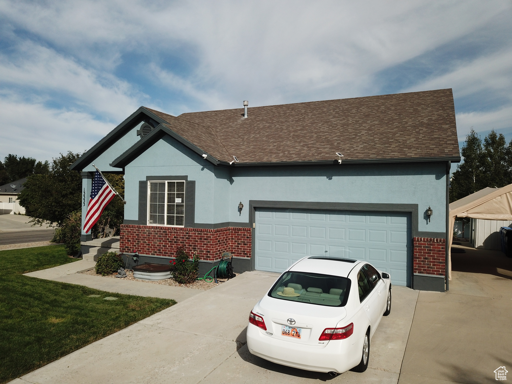 View of front of property featuring a garage