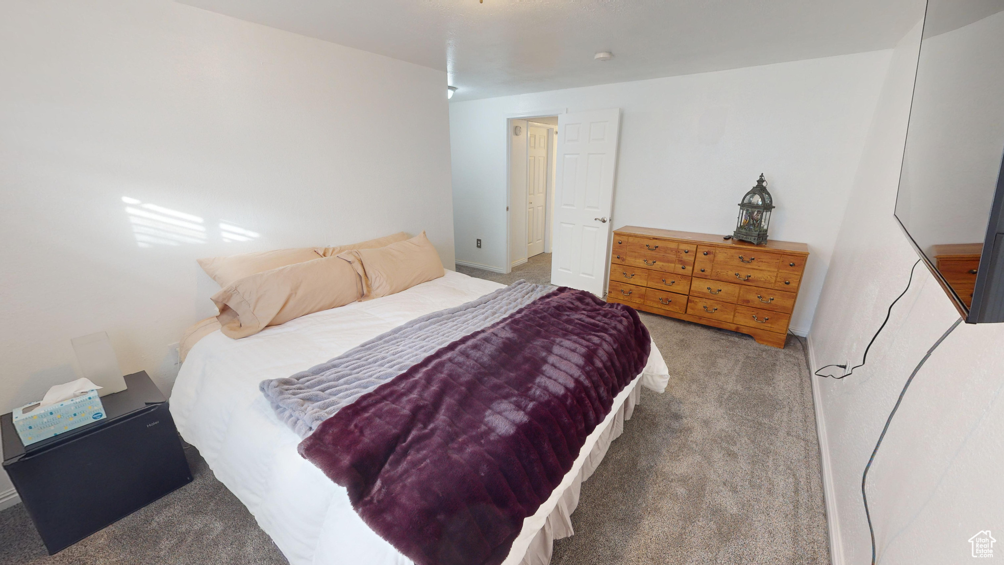 Bedroom with light colored carpet