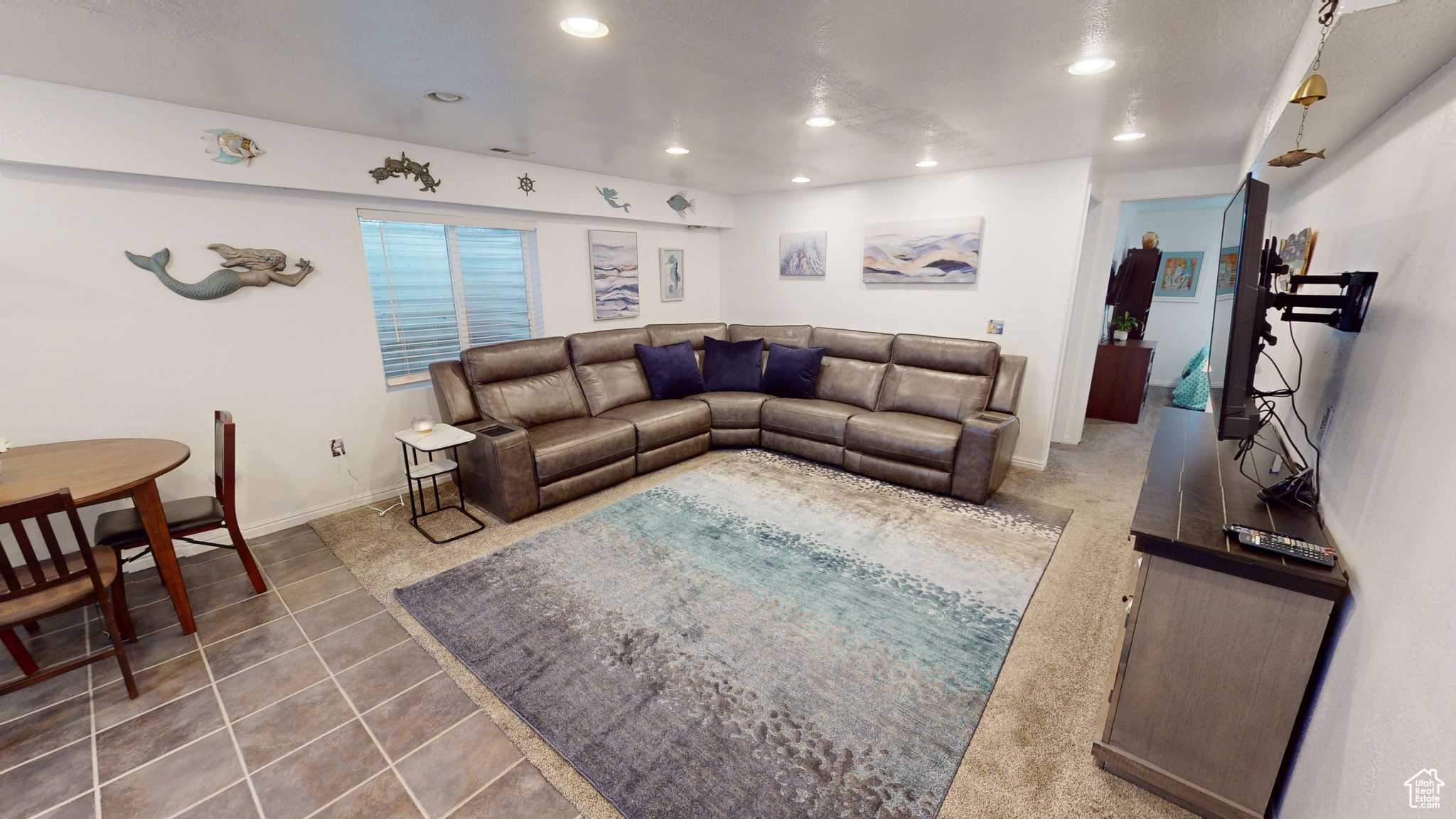 Living room featuring dark tile patterned floors