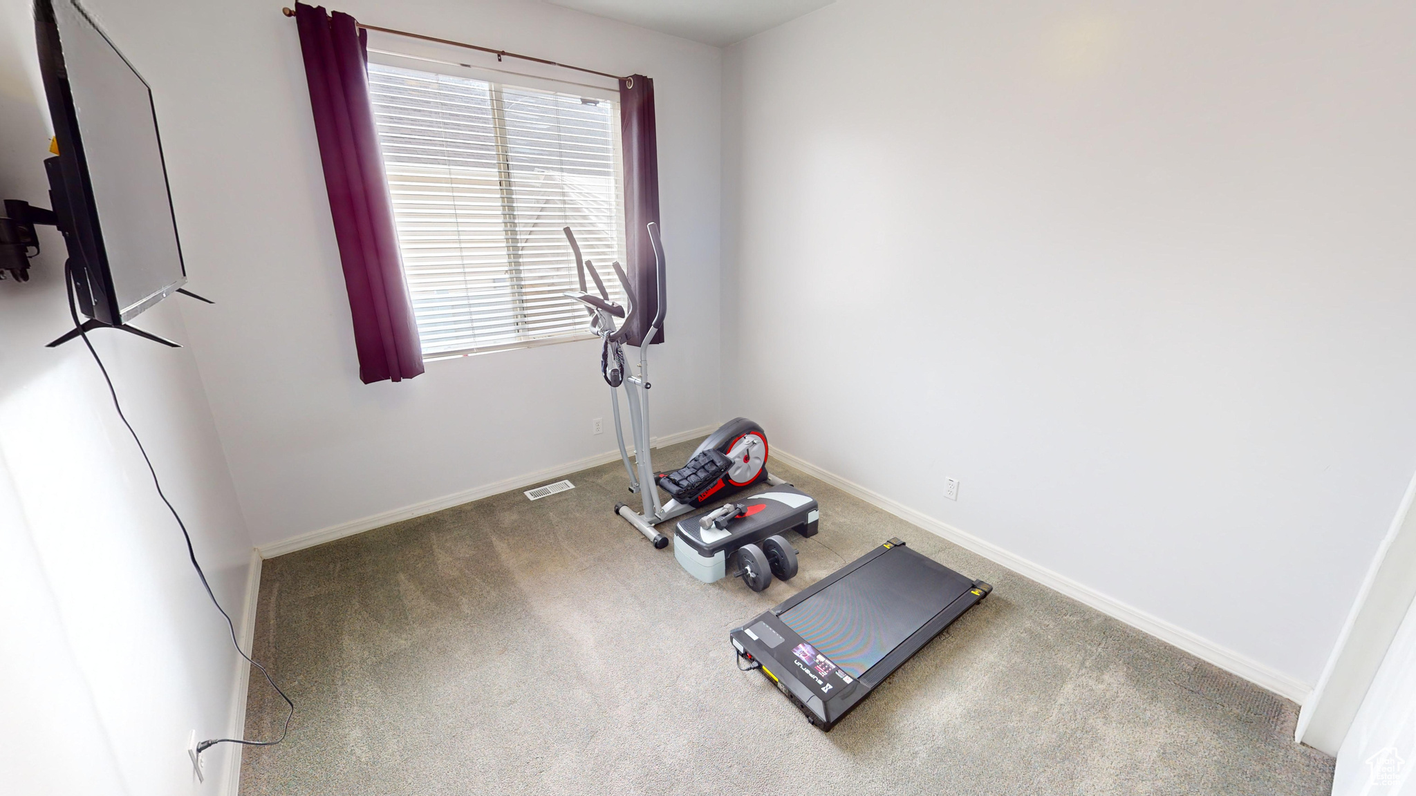 Exercise area featuring carpet floors