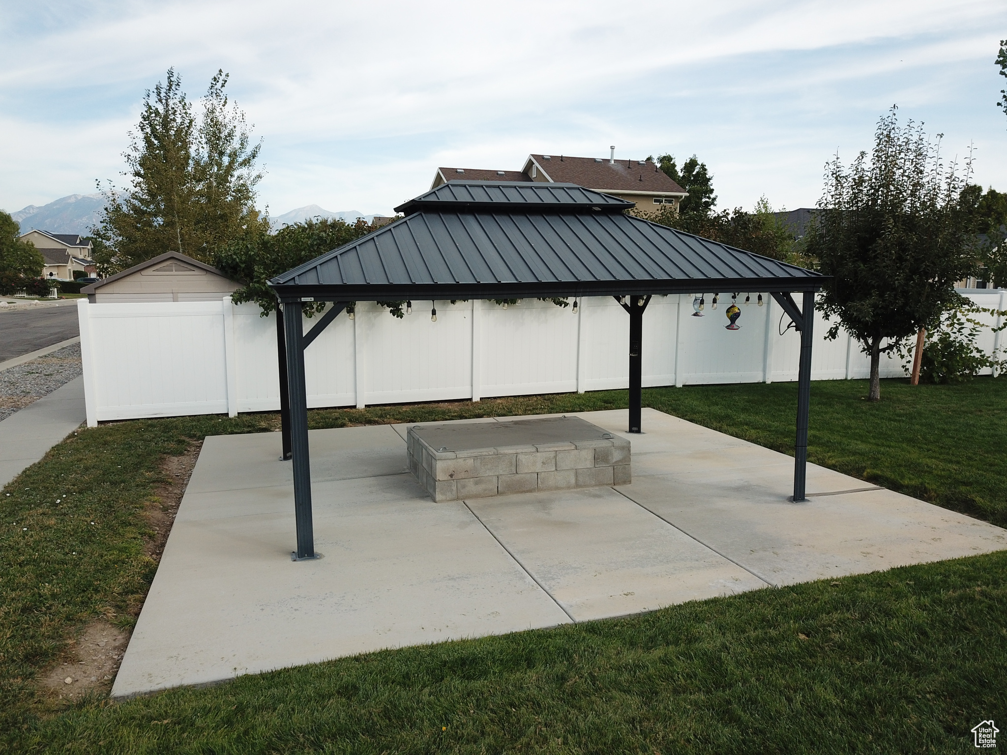 View of patio with a gazebo and a mountain view