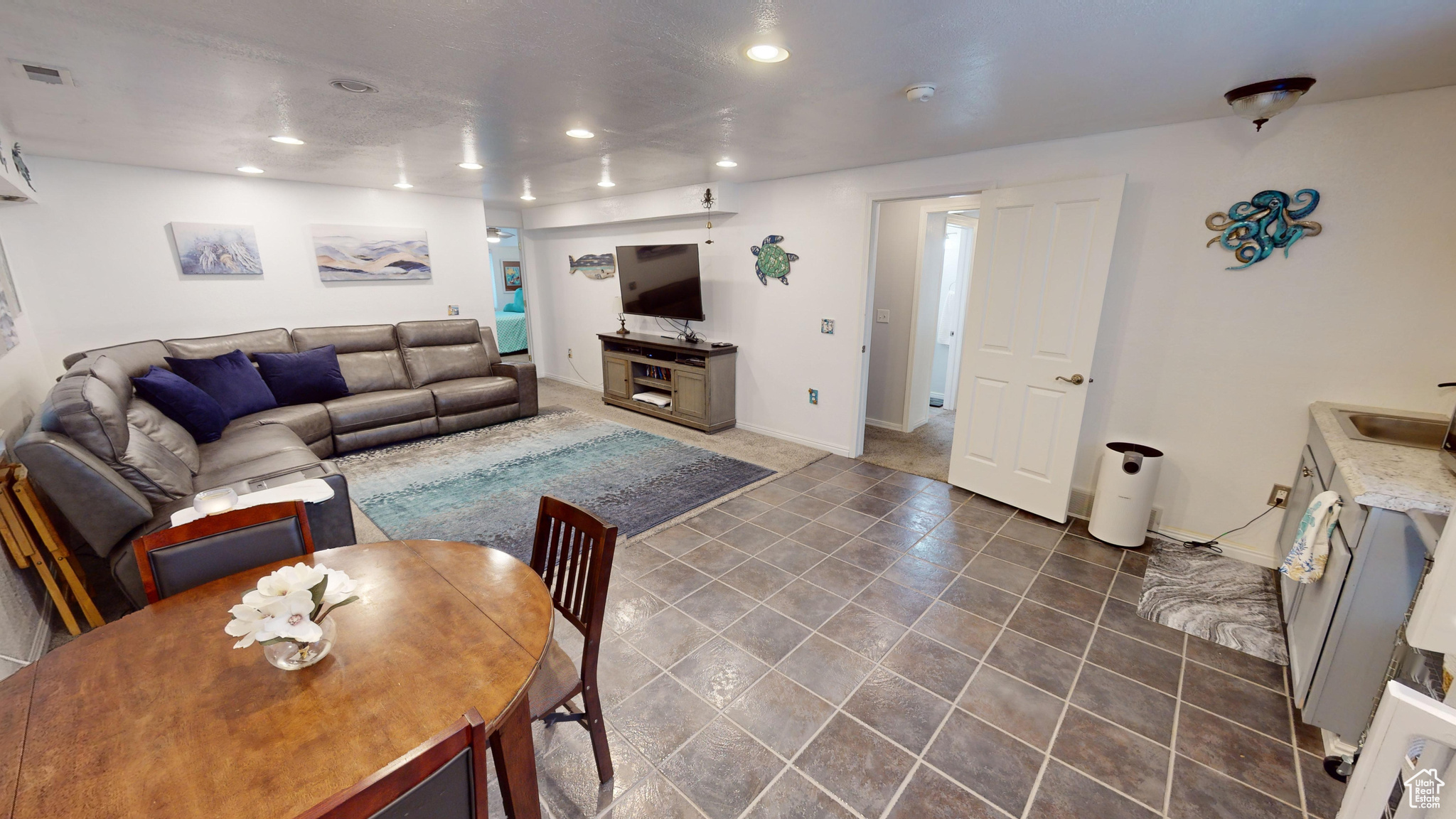 Living room featuring dark tile patterned flooring