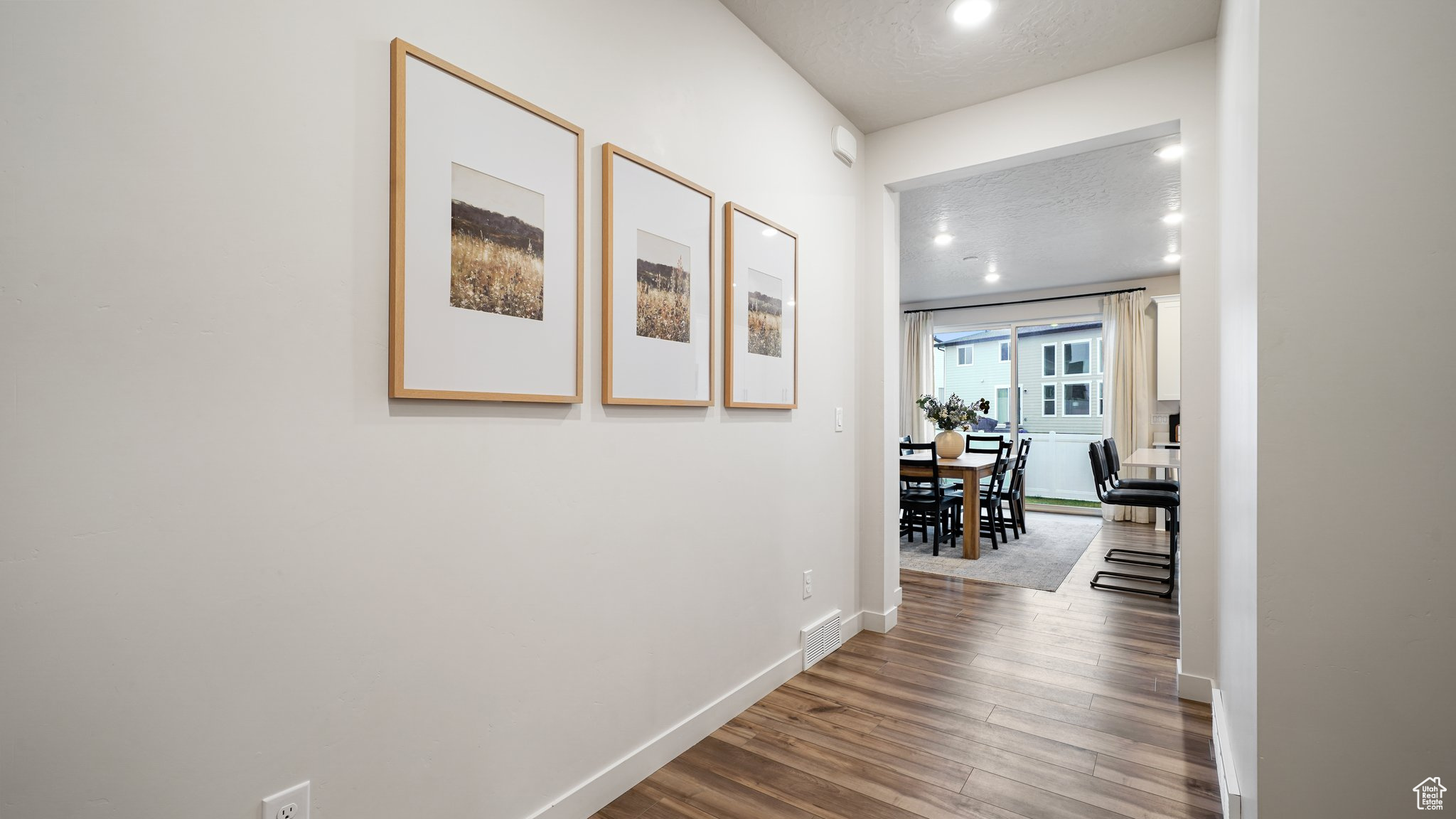 Entryway featuring hardwood / wood-style floors and a textured ceiling