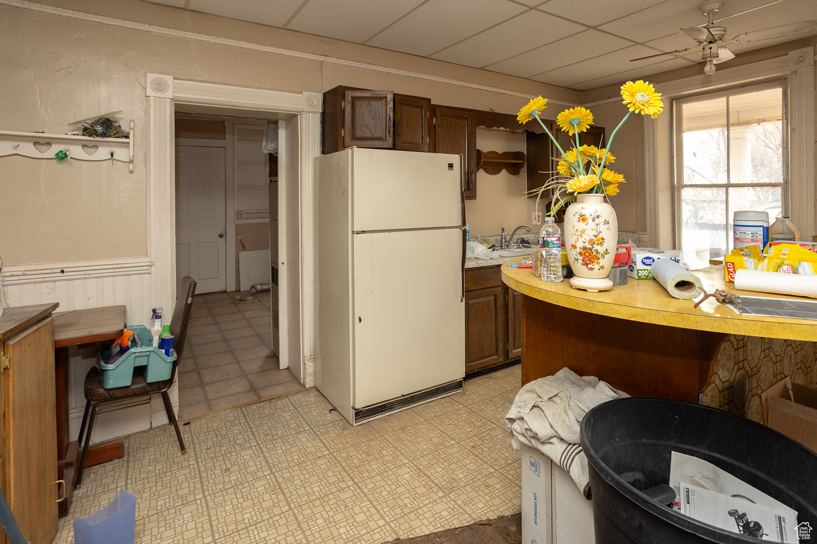 Kitchen with white fridge and sink