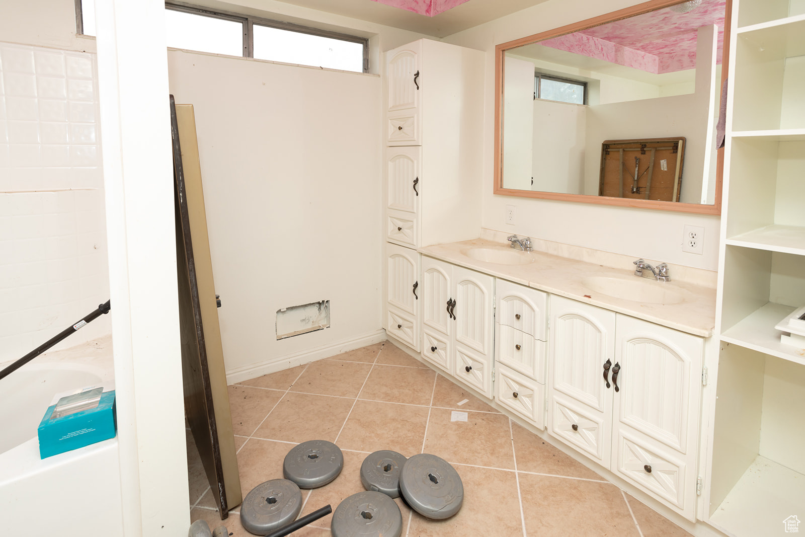 Bathroom featuring tile patterned flooring and vanity