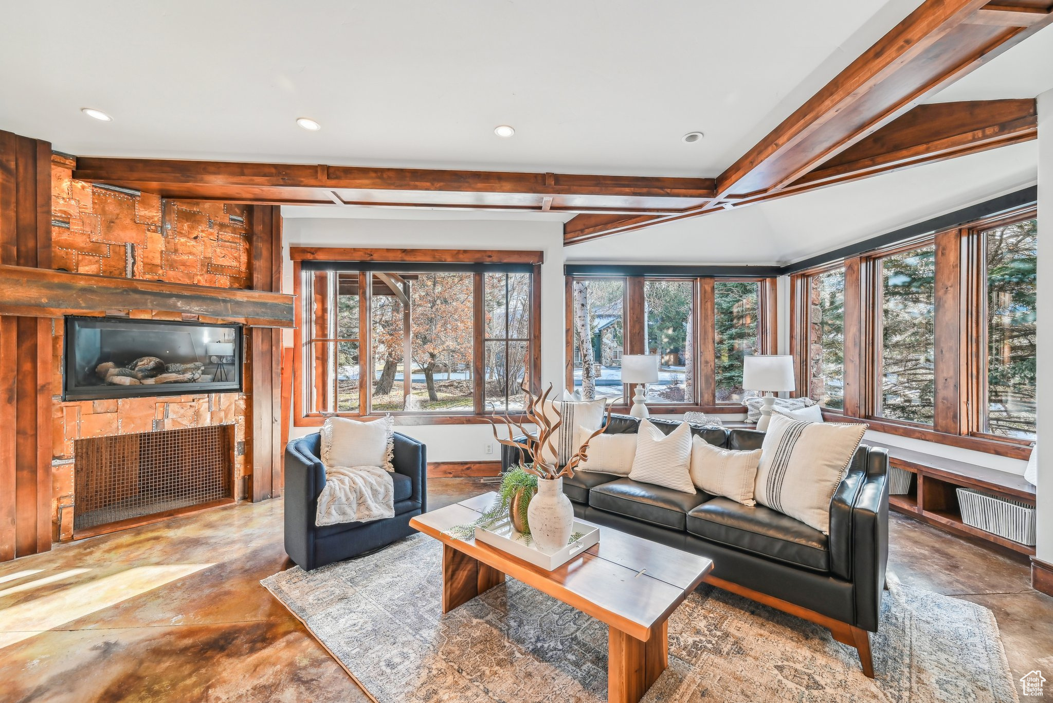 Living room featuring a fireplace and beamed ceiling