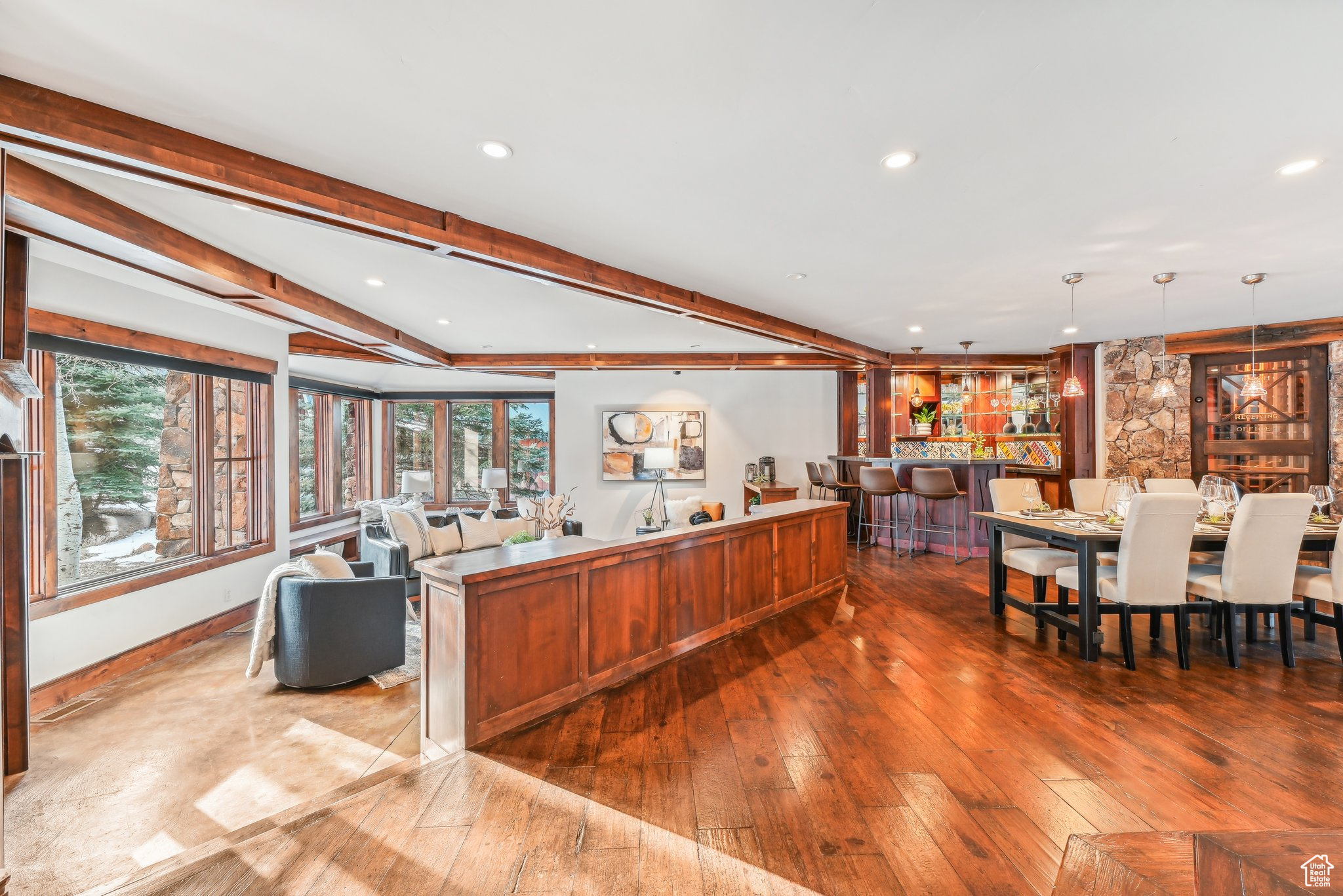 Living room with beamed ceiling and hardwood / wood-style flooring