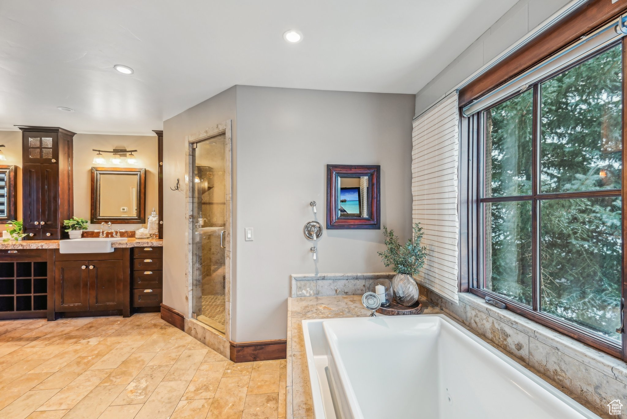 Bathroom with vanity and independent shower and bath