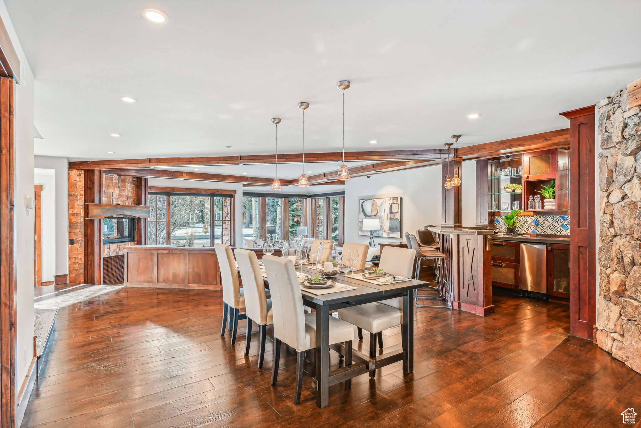 Dining area with dark hardwood / wood-style floors