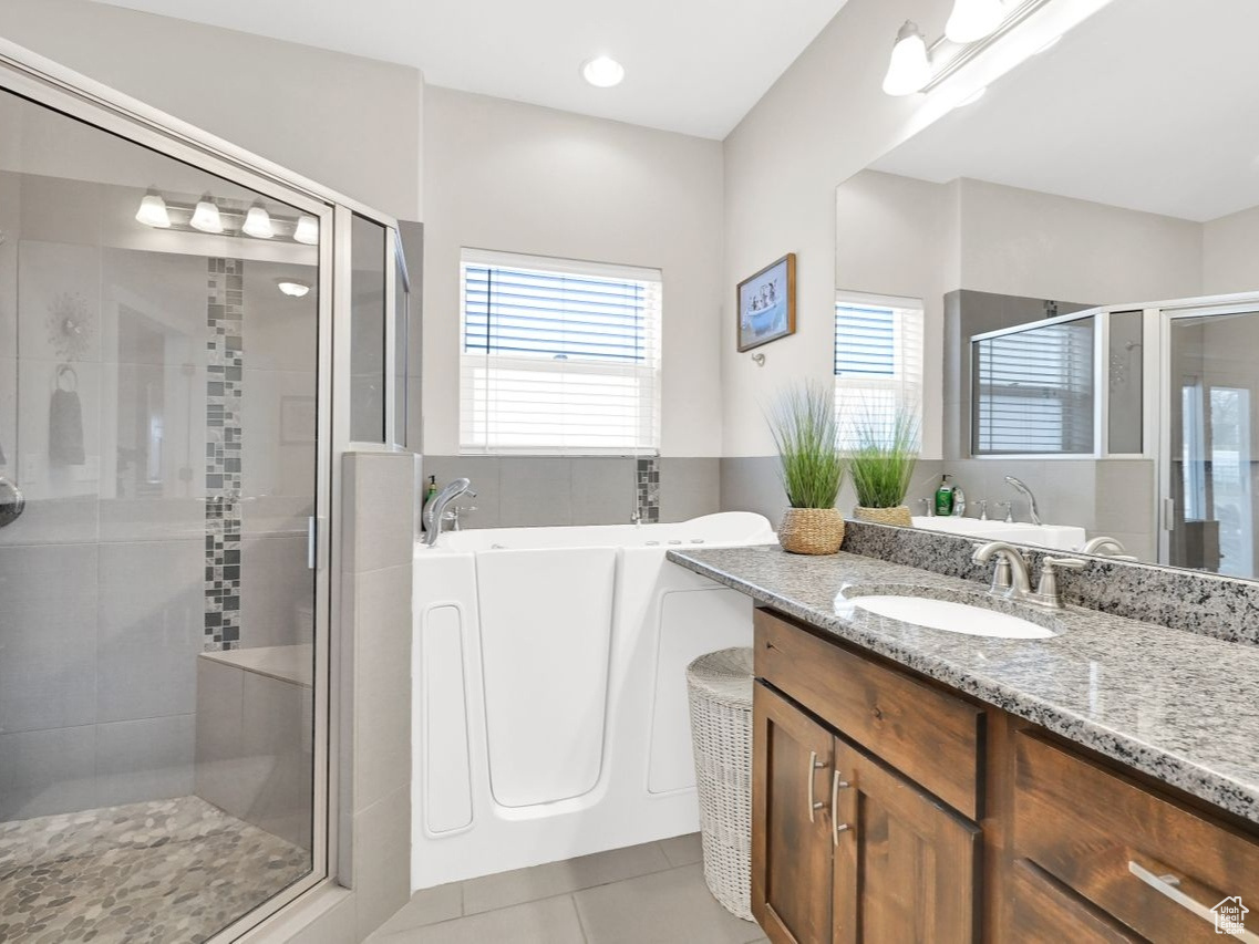 Beautiful granite countertop, tile shower and convenient walk-in tub.