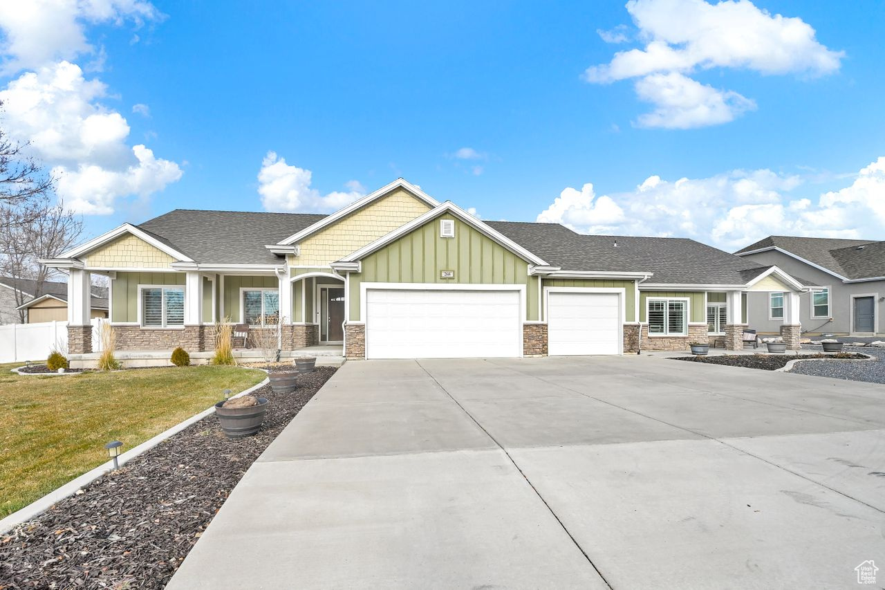 Craftsman sylte house with large porch, 4 car garage and In-Law Suite.