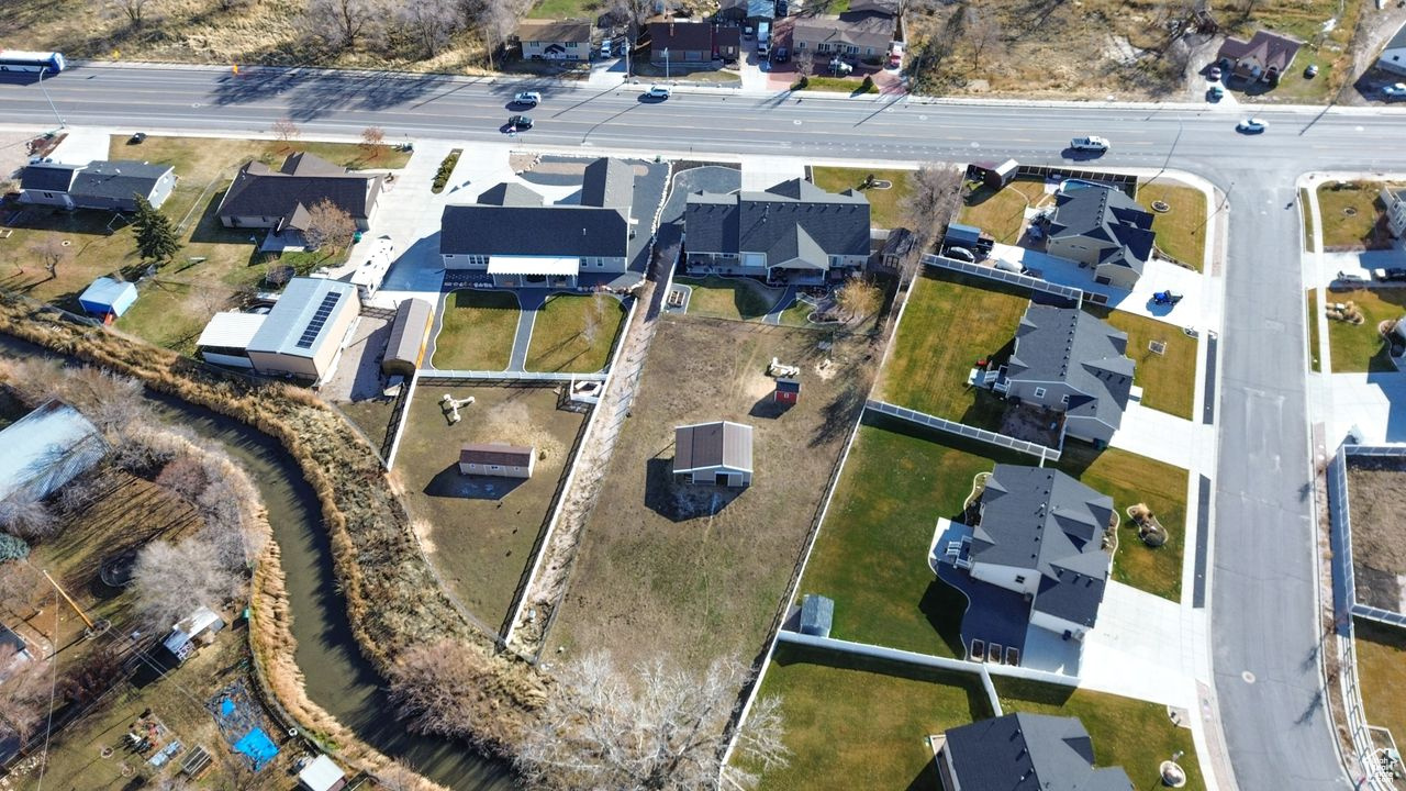 Aerial view of lot and canal on north end of property - fully fenced between lot and canal.