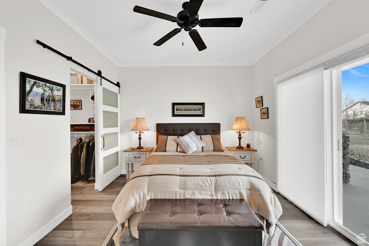 Charming barn door access to the walk-in closet.