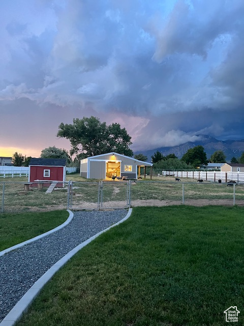 Fully fenced pasture with barn and chicken coop.