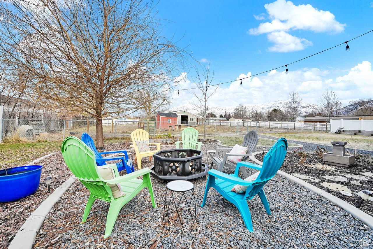 View of yard with an outdoor fire pit