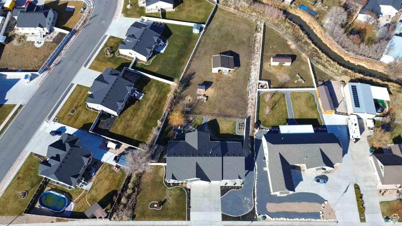 Bird's eye view. Canal borders the north side of the property (fenced).