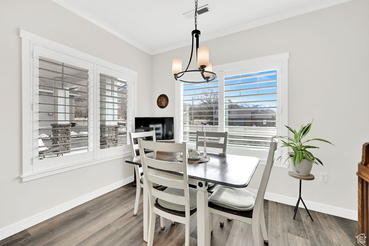 Dining area is light and bright with lovely chandelier.