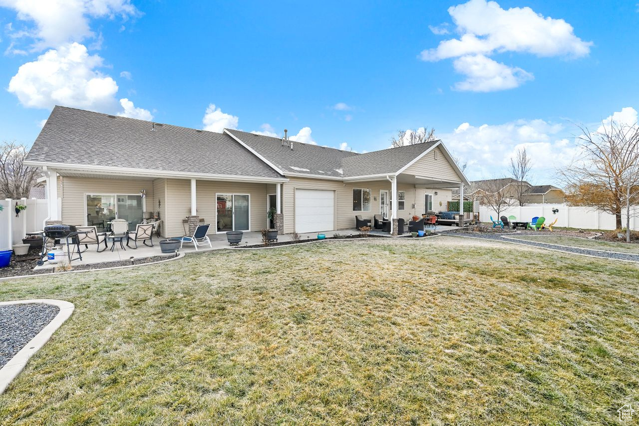 Two covered patios and deck.  Garage features a full garage door to the backyard.