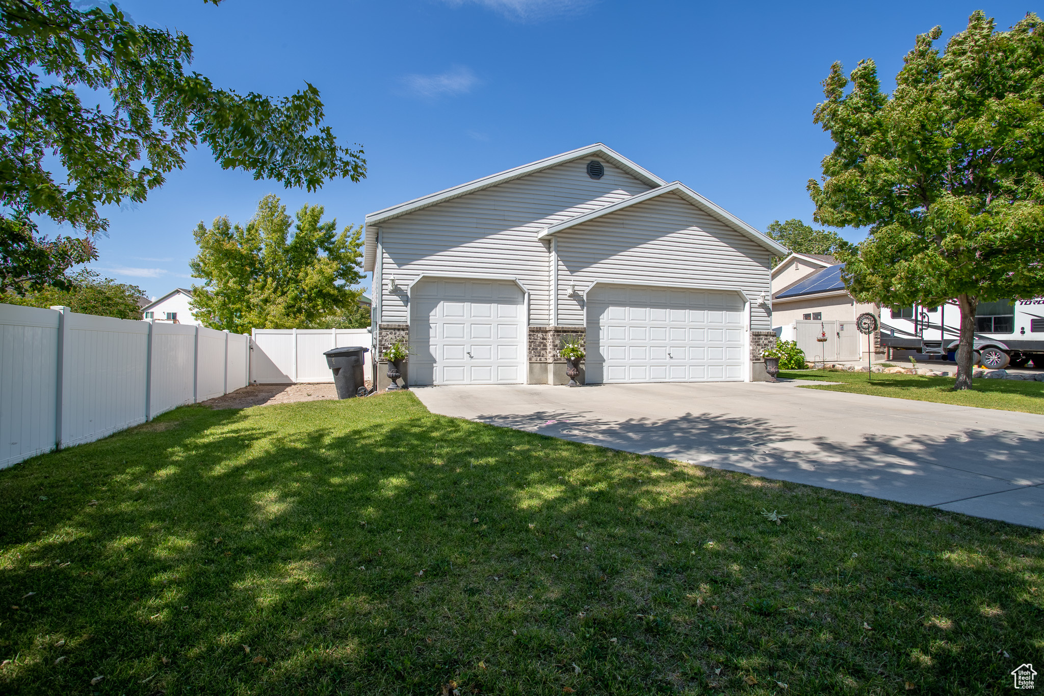 Exterior space featuring a garage and a front yard