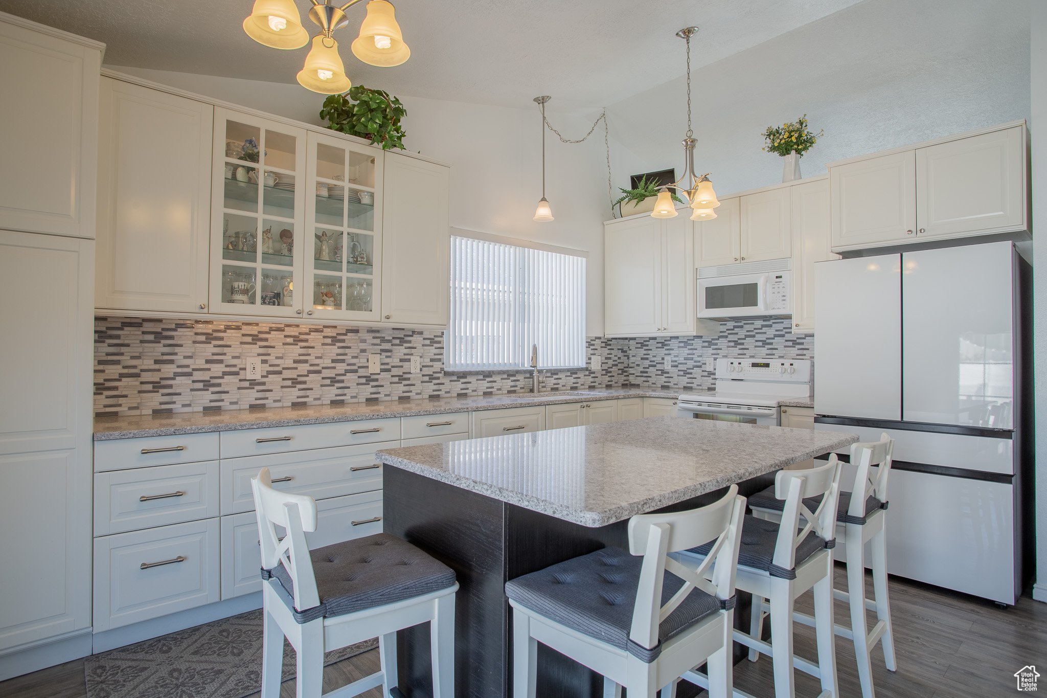 Kitchen with white cabinets and white appliances