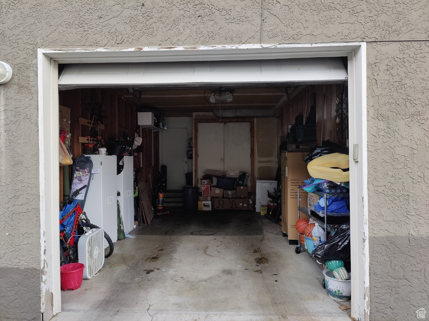 Garage featuring a garage door opener