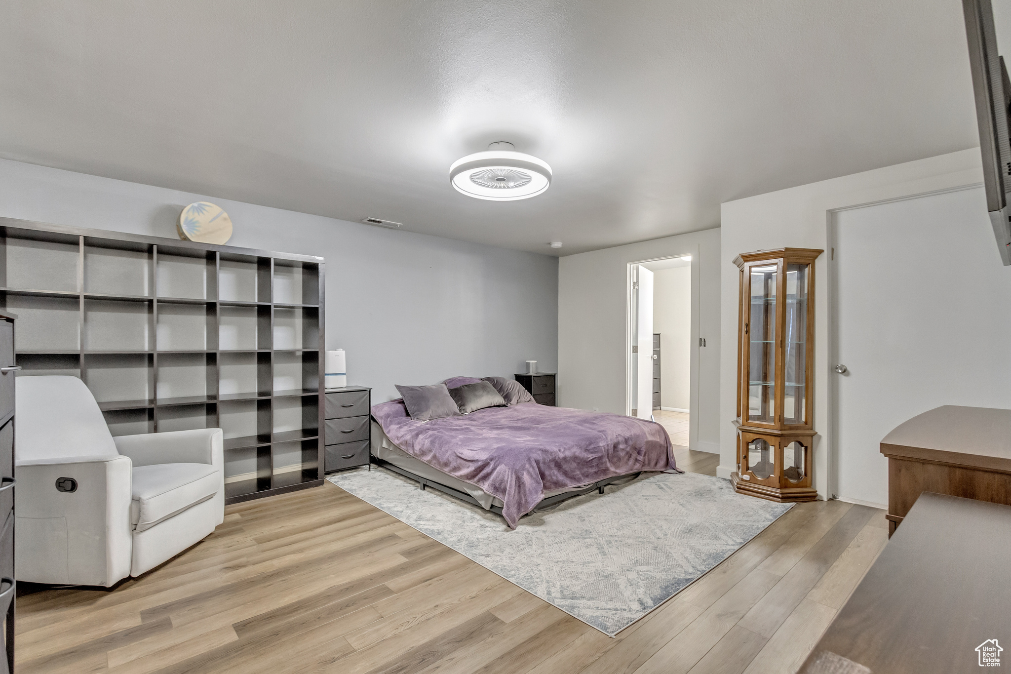 Bedroom with light hardwood / wood-style floors