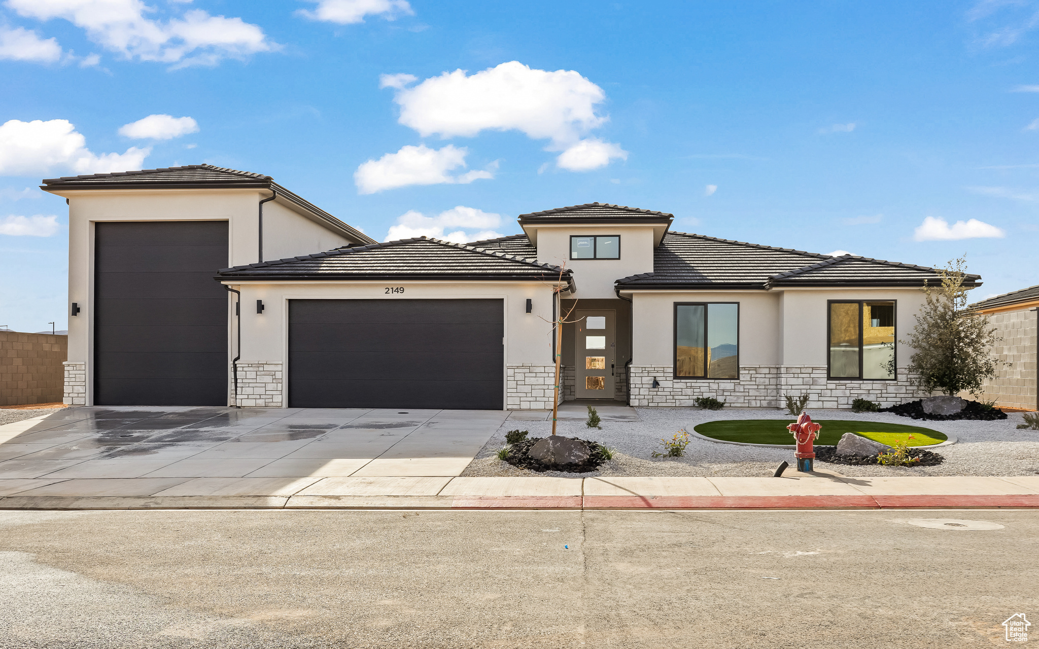 Prairie-style home featuring a garage