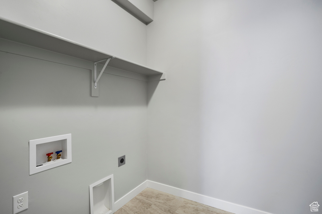 Laundry area featuring electric dryer hookup and hookup for a washing machine