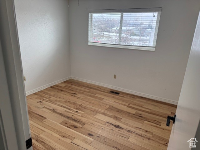 Spare room featuring light hardwood / wood-style flooring