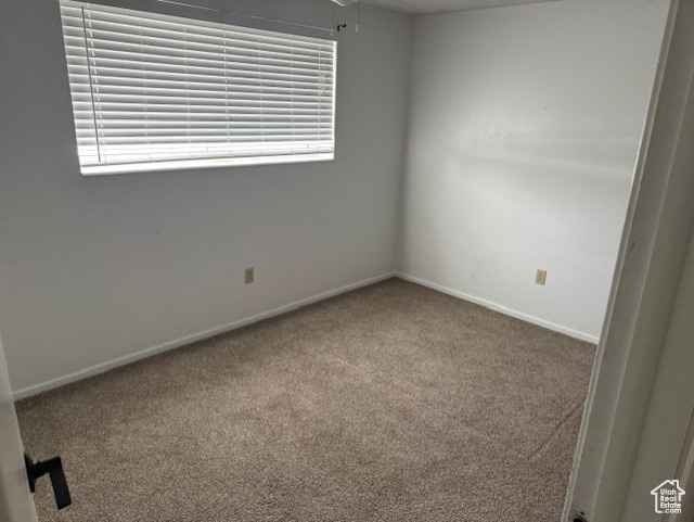 Empty room with carpet flooring