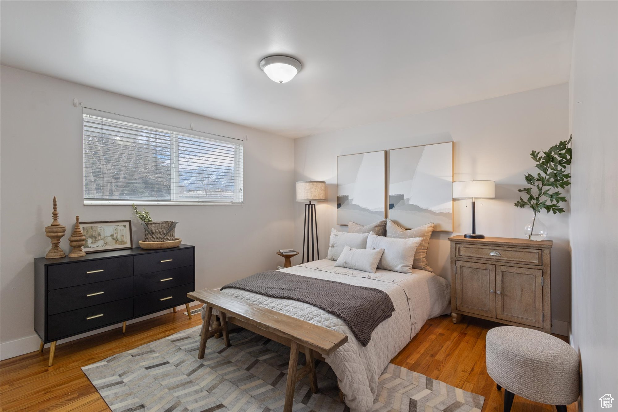 Bedroom with light hardwood / wood-style floors