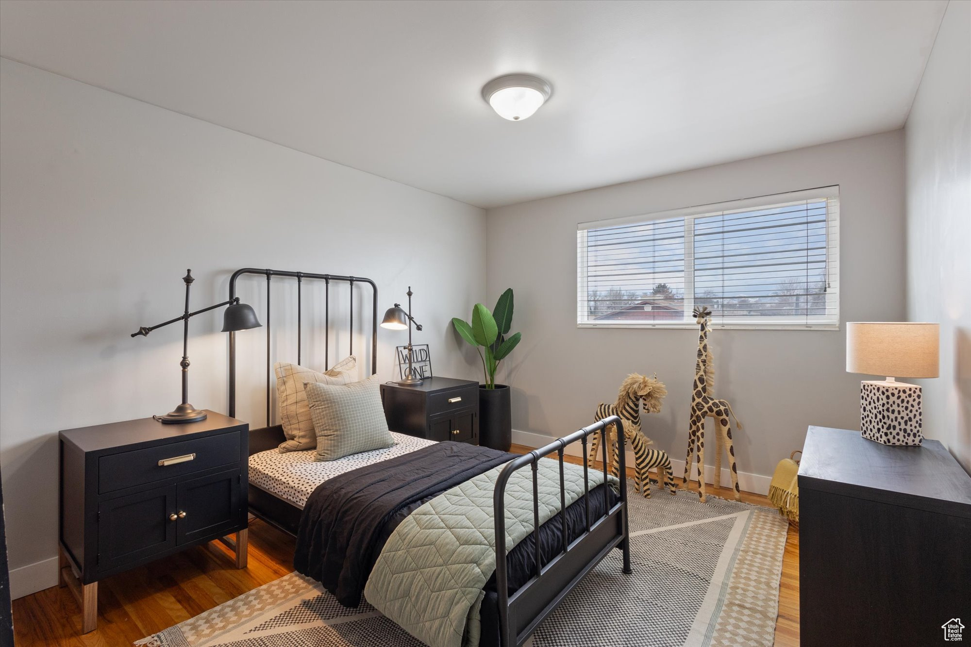 Bedroom with wood-type flooring