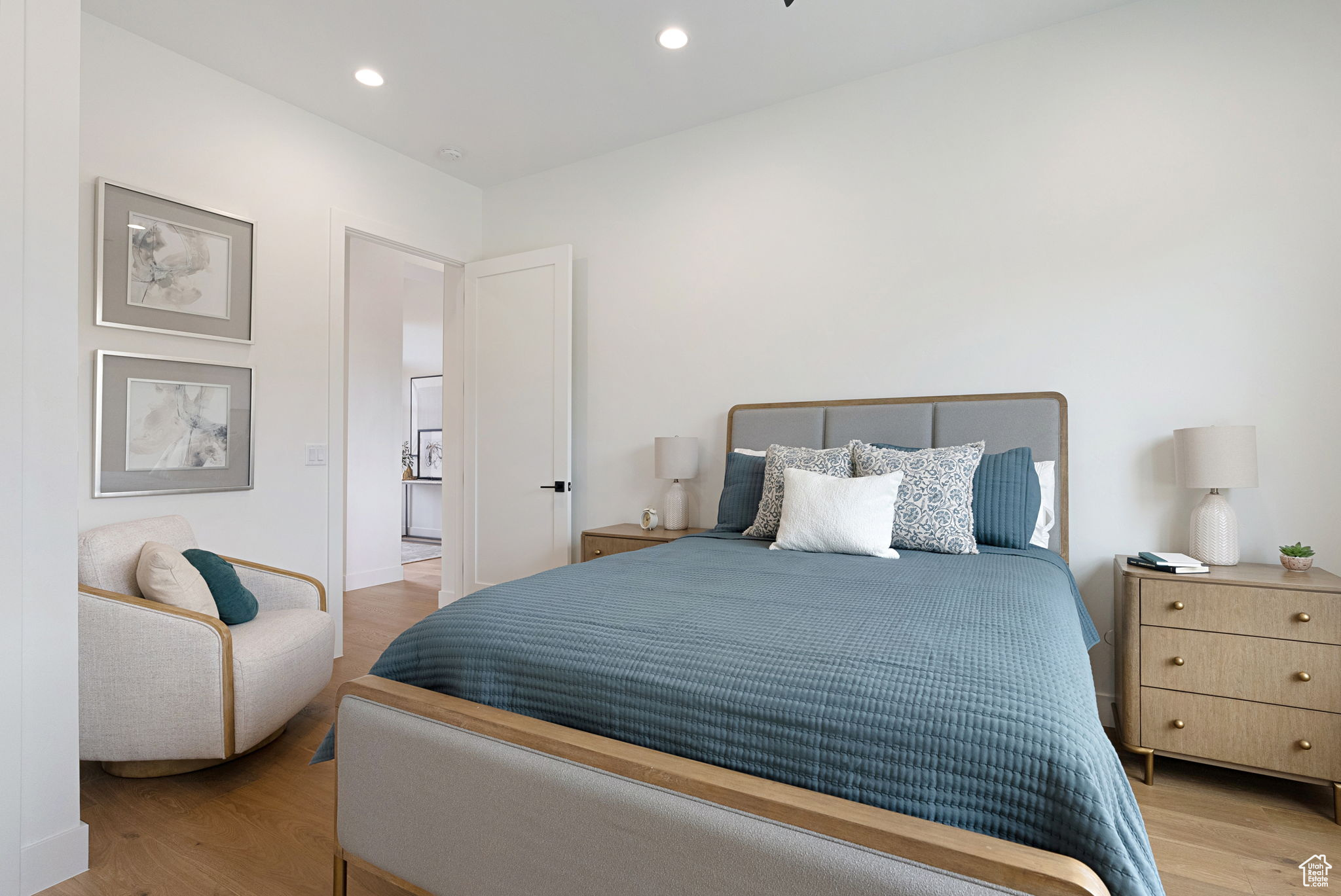 En-Suite Bedroom featuring light hardwood / wood-style flooring