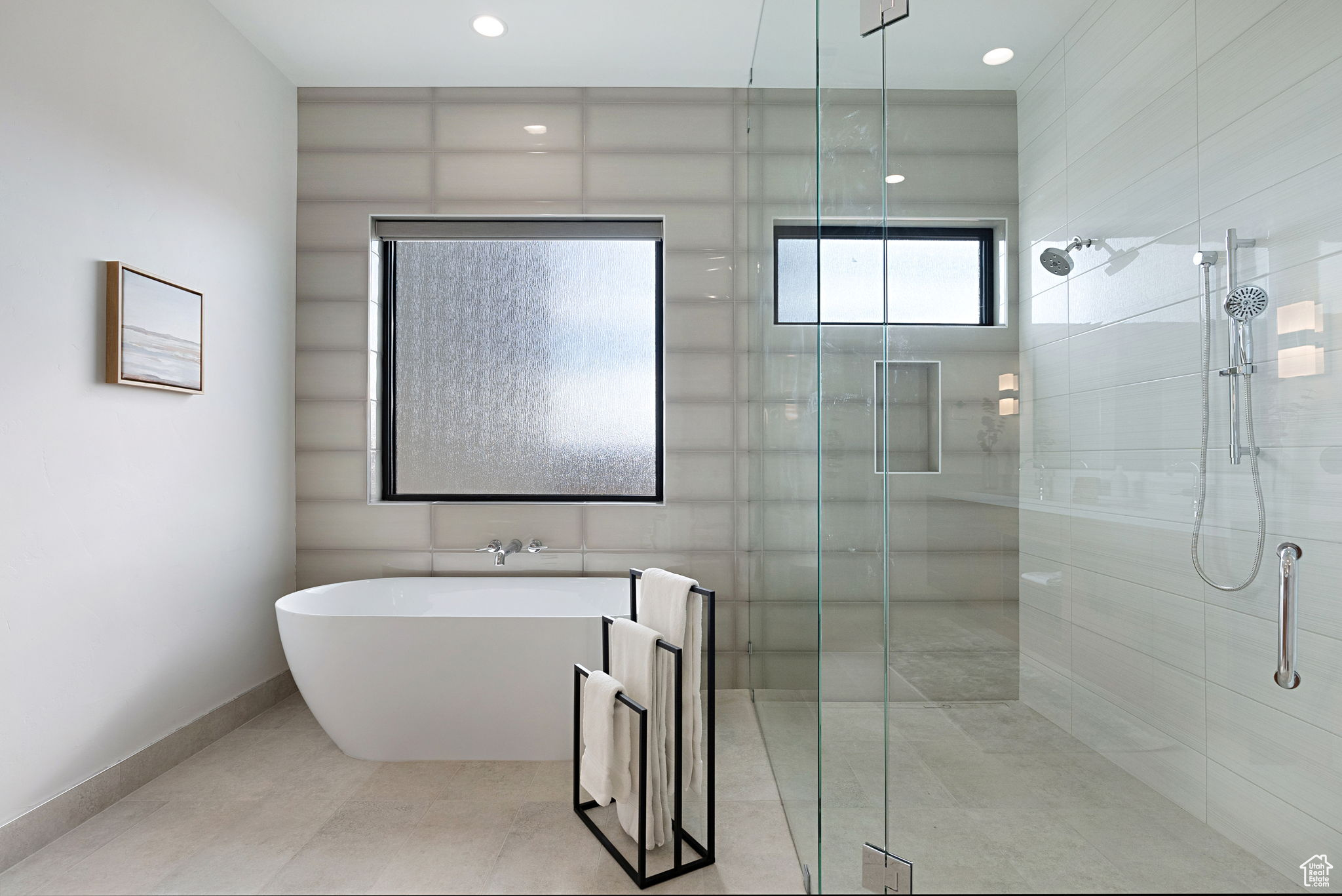 Bathroom featuring shower with separate bathtub