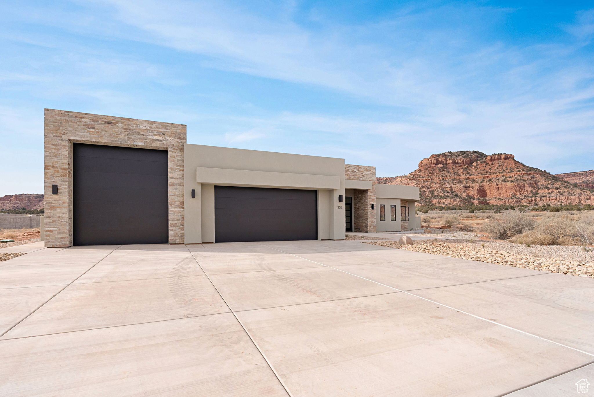 View of front facade featuring a mountain view and a garage