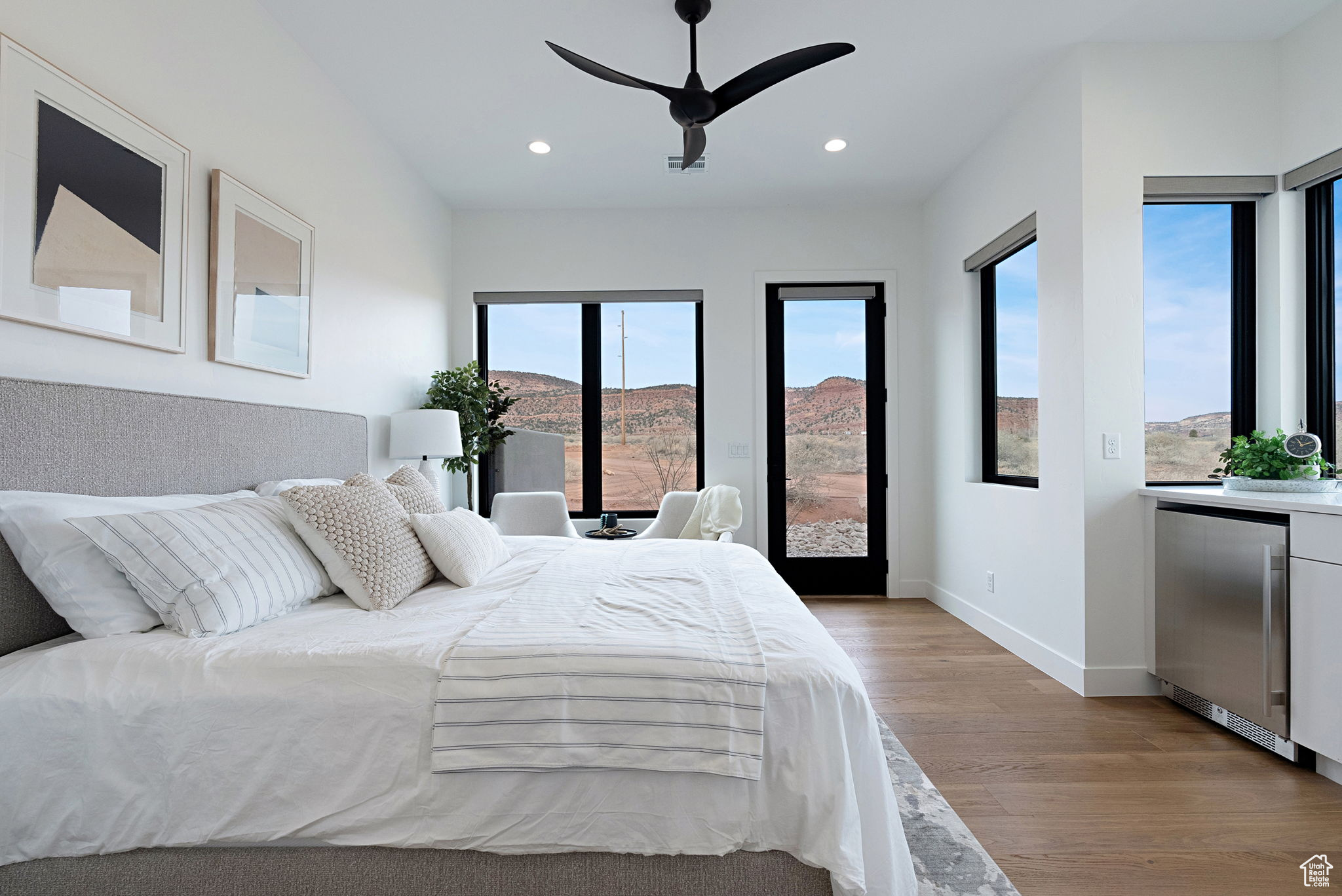 Bedroom with a mountain view, refrigerator, light hardwood / wood-style floors, and ceiling fan. Casita with Kitchenette