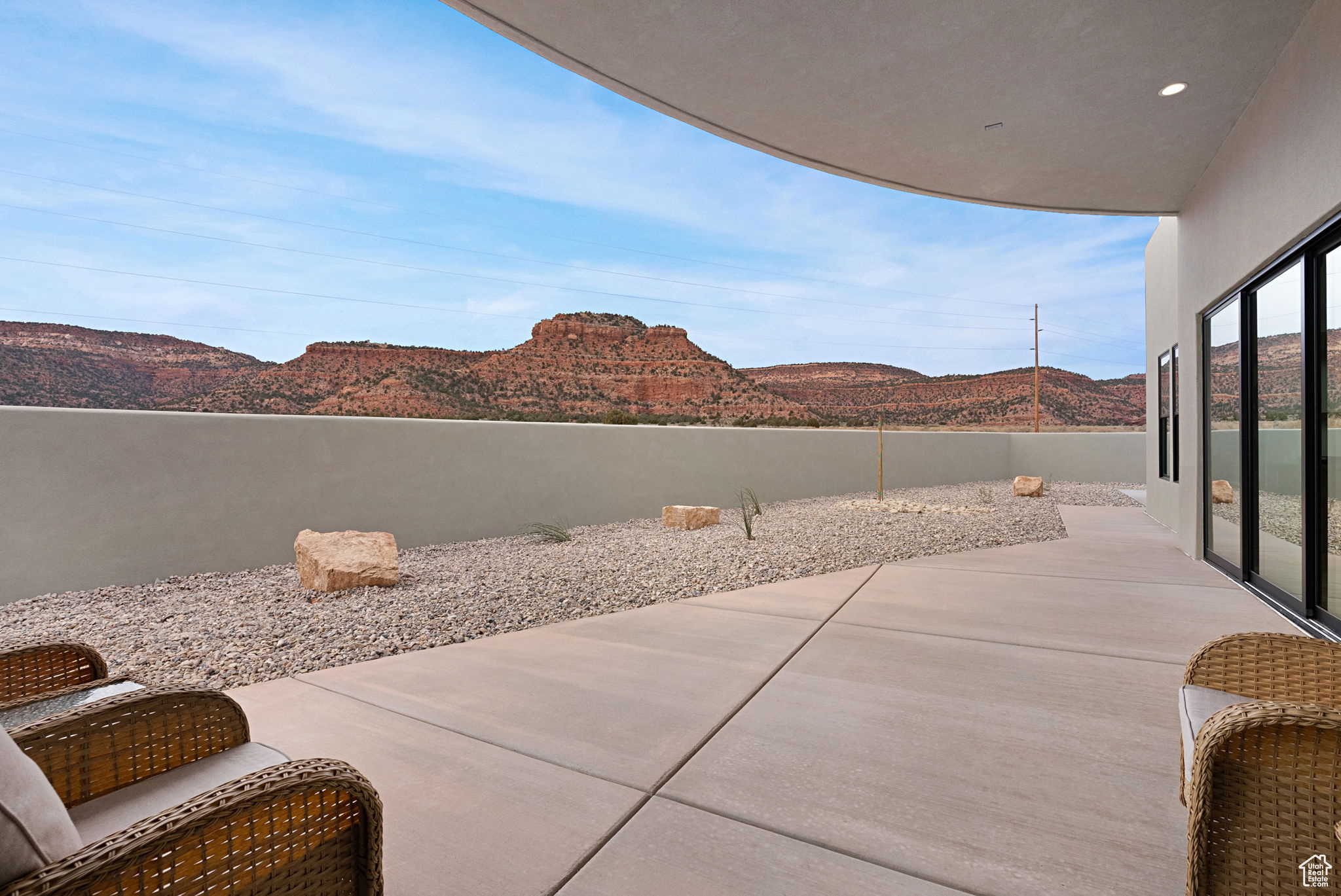 View of patio / terrace featuring a mountain view off of primary bedroom