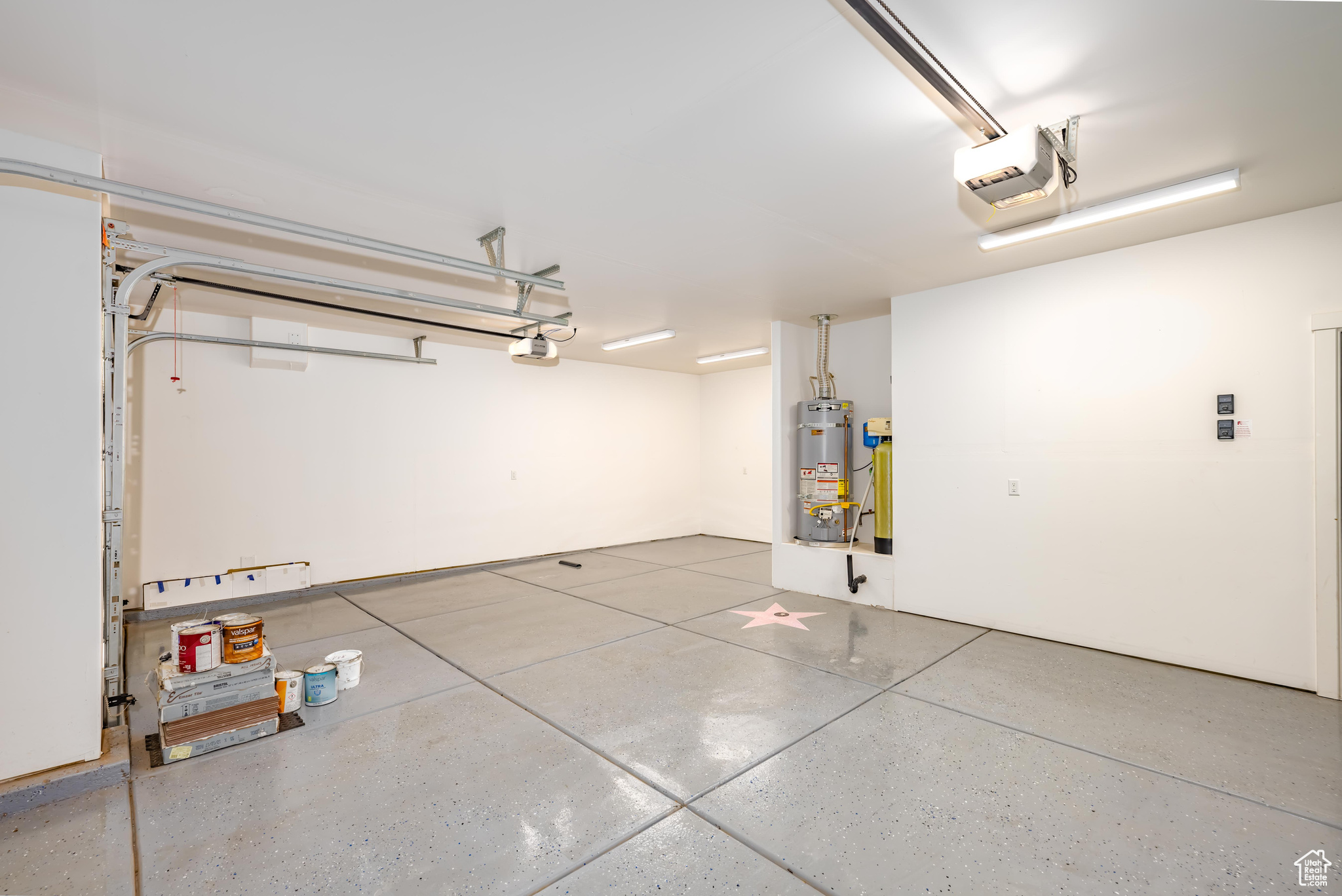 Garage with secured water heater and a garage door opener