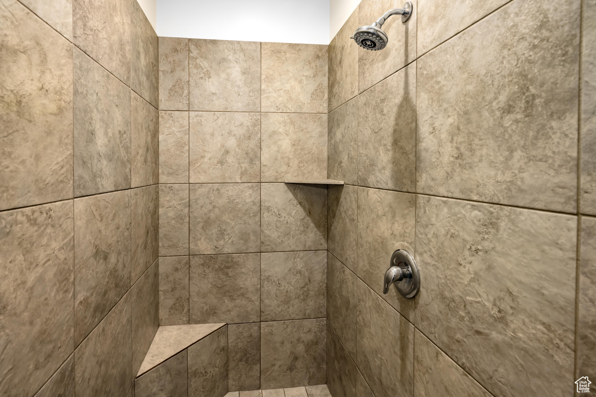 Details with a tile shower