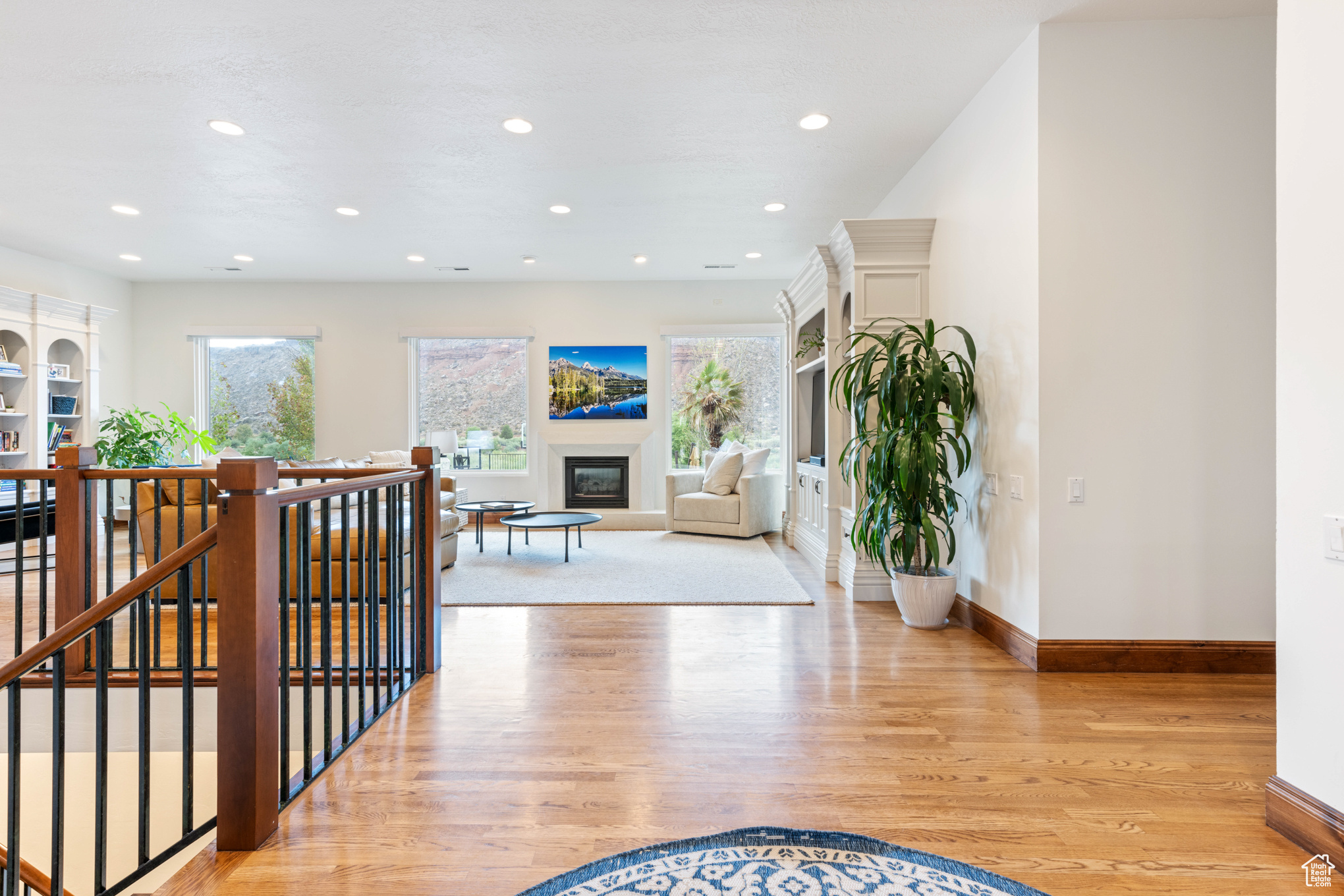 Hallway with light hardwood / wood-style floors