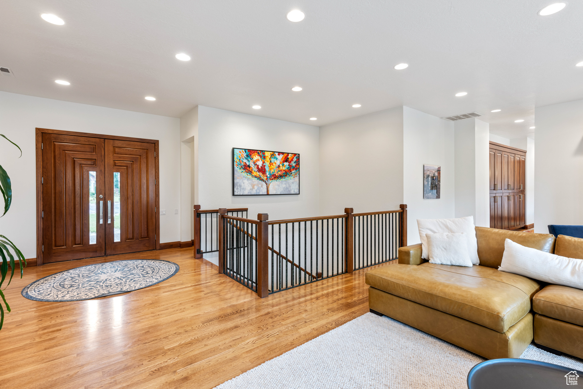 Living room with light hardwood / wood-style flooring