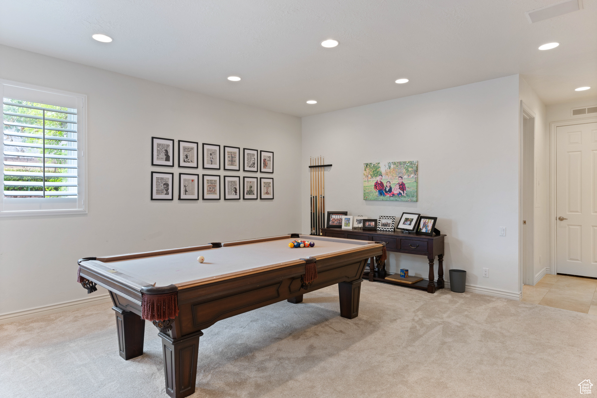 Playroom with light colored carpet and pool table